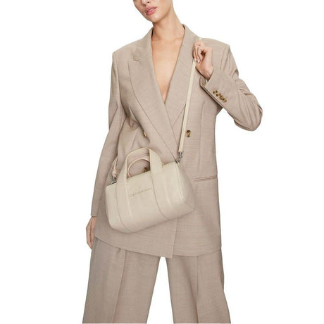 Calvin Klein Jeans Beige Synthetic Leather Handbag - Hilstor