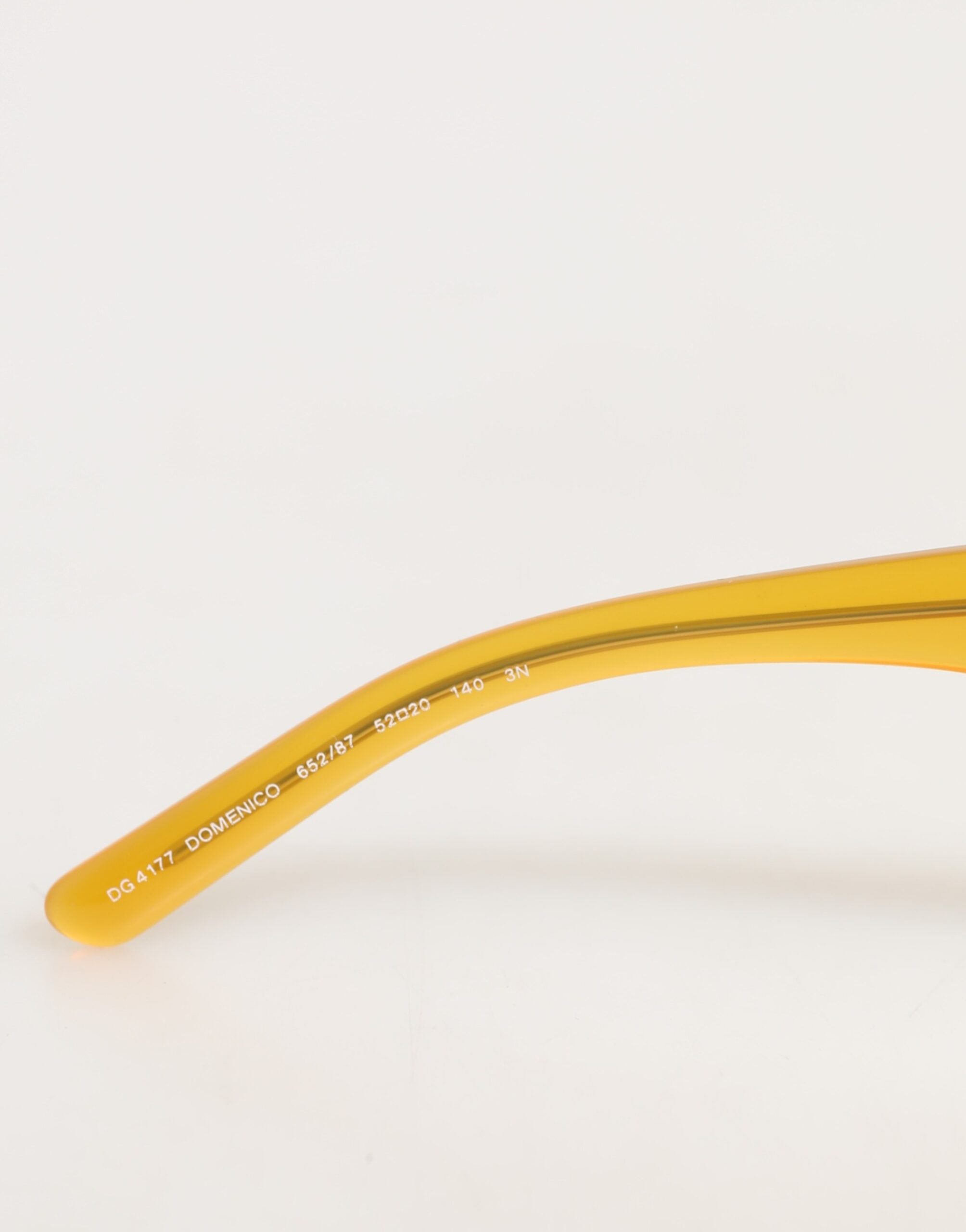 Dolce & Gabbana DG4177 solbriller med honningfarvet acetat og sorte tonede glas